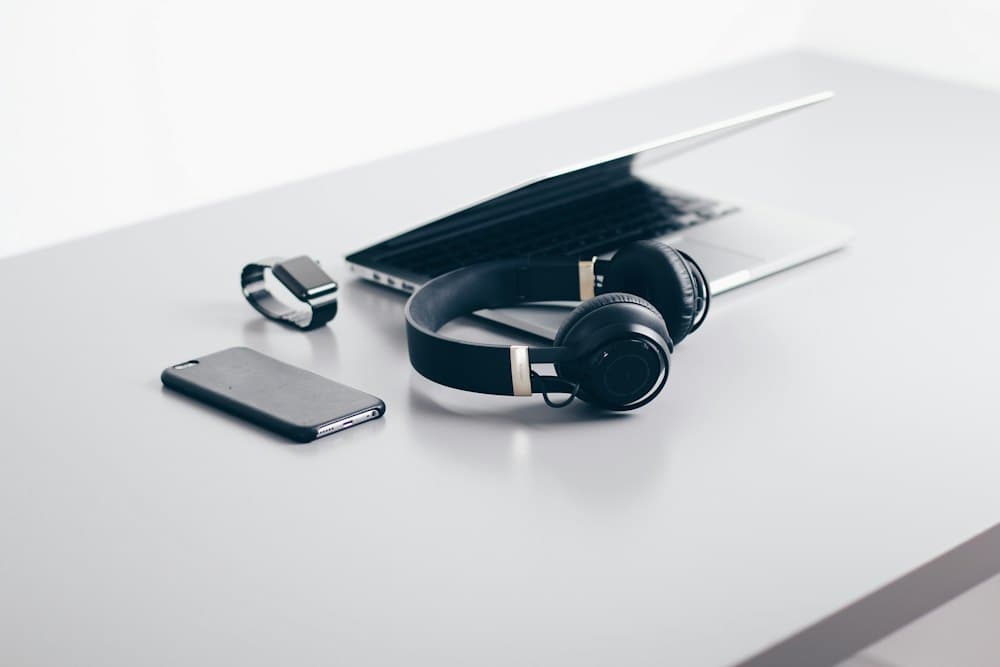 Desk with laptop and headphones